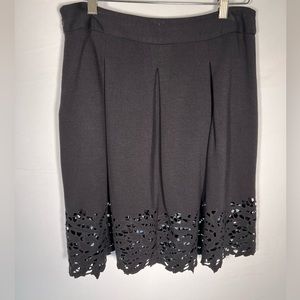 Black BCBG knit skirt with cutout hem